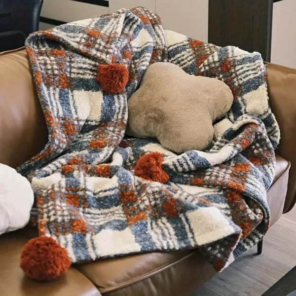 Plaid de Noël doux à carreaux rouges avec pompons – ambiance chaleureuse garantie
