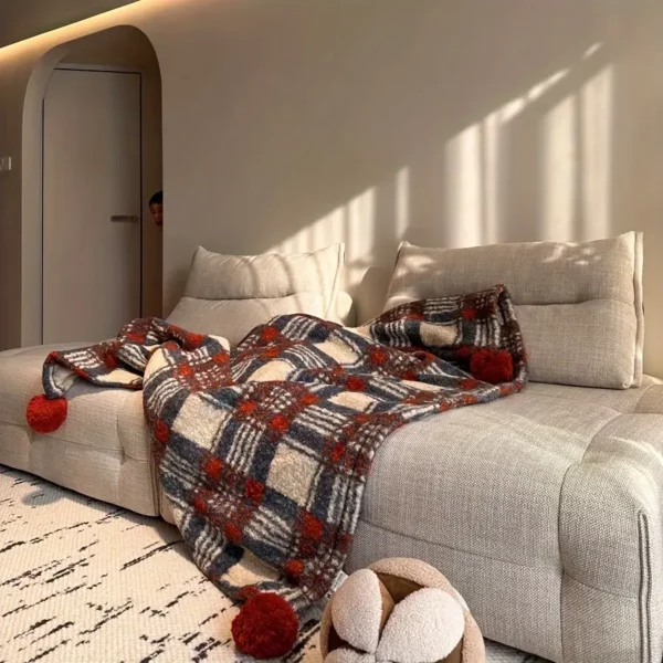 Plaid de Noël doux à carreaux rouges avec pompons – ambiance chaleureuse garantie